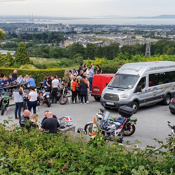 a group of people riding on the back of a motorcycle