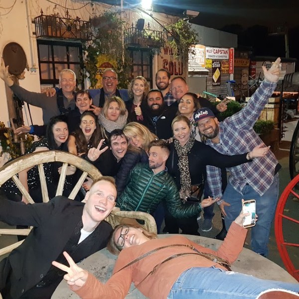 a group of people sitting posing for the camera