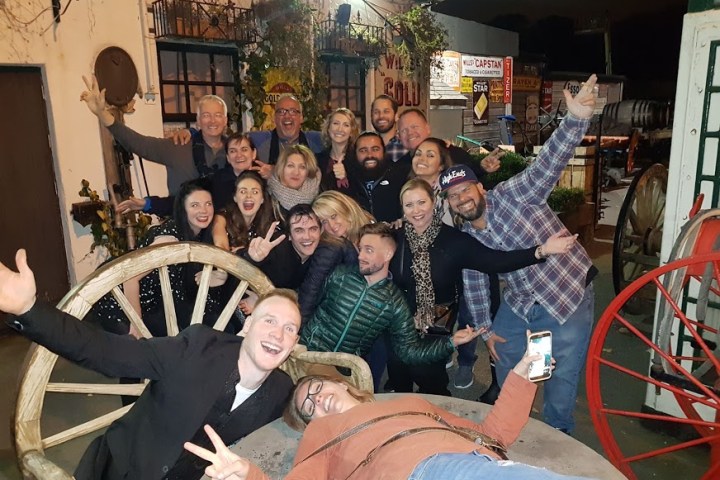 a group of people sitting posing for the camera