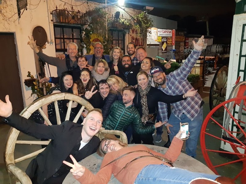 a group of people sitting posing for the camera