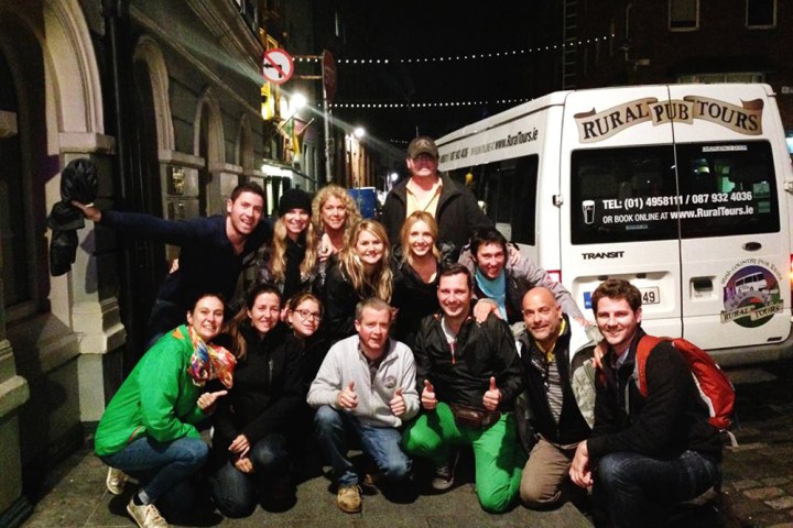 Ralph Velasco et al. standing in front of a crowd posing for the camera