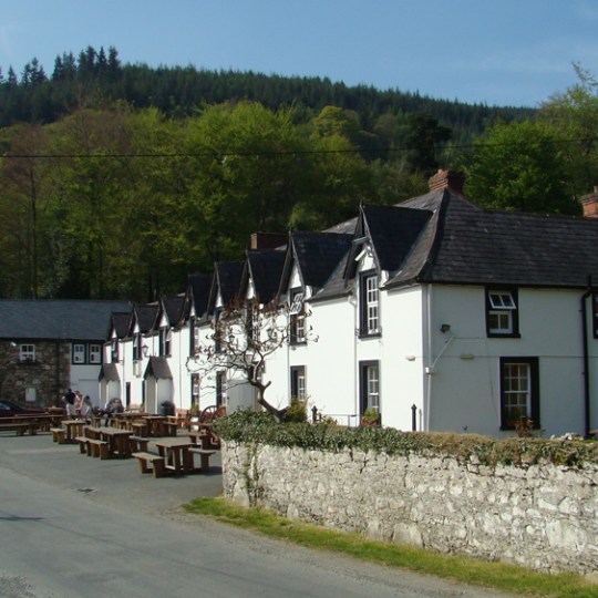 a house on the side of a road